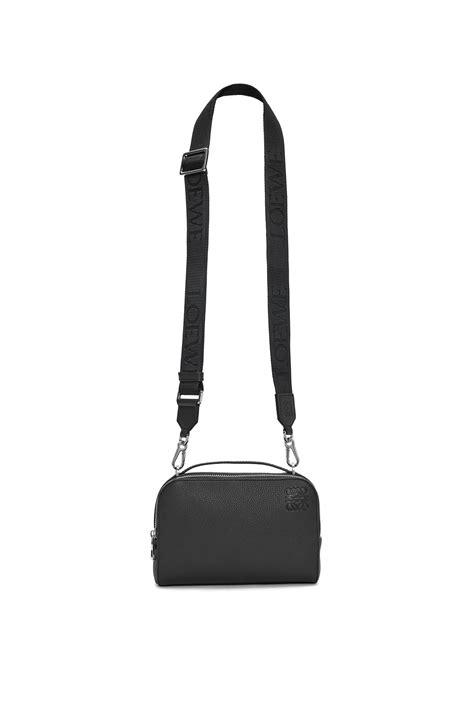 Mini Camera Crossbody bag in soft grained calfskin.